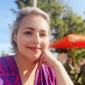 Lily Mulholland, looing straight at the camera, smiling